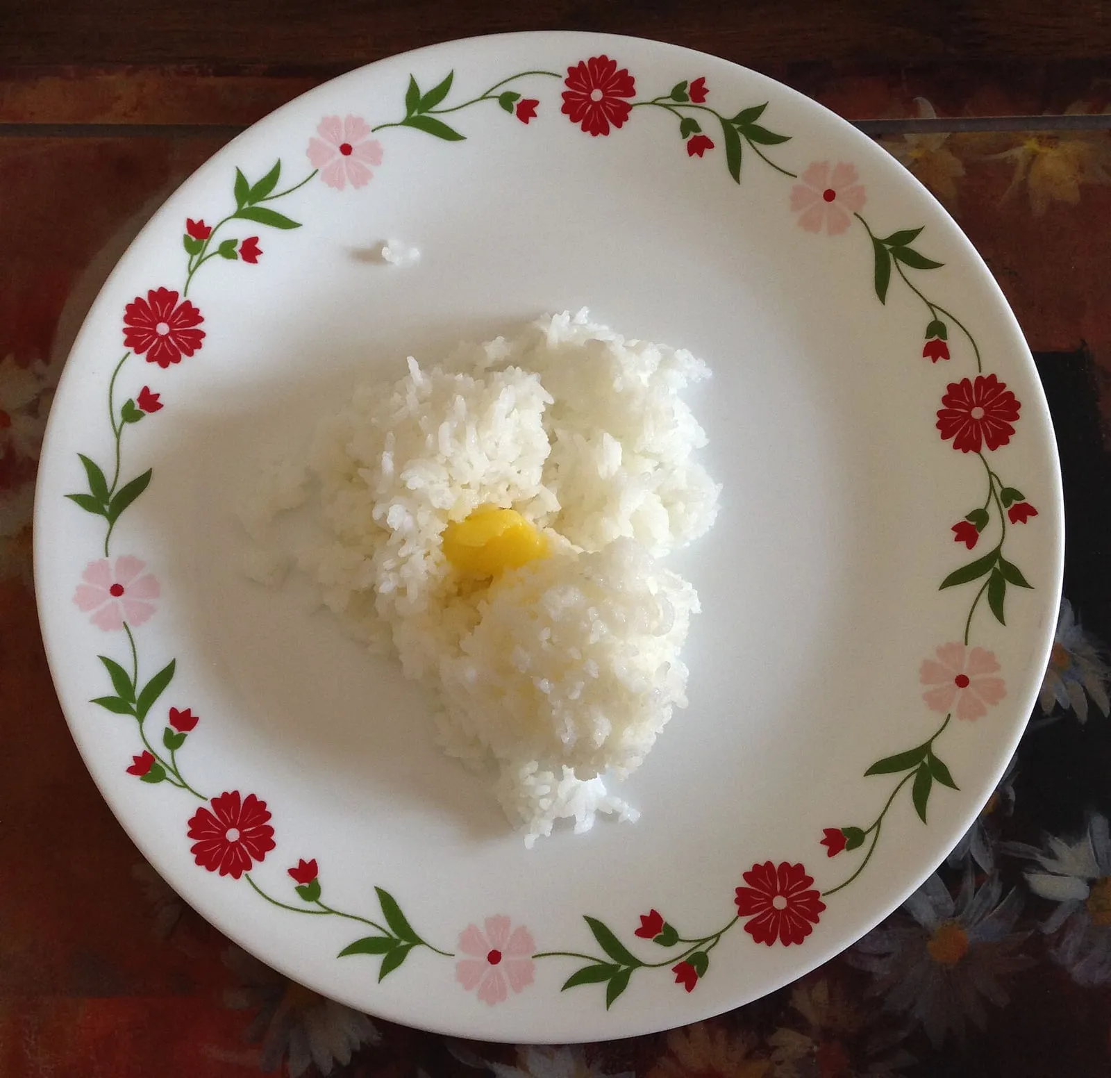 Ghee rice topped with fried onions, cashews and raisins