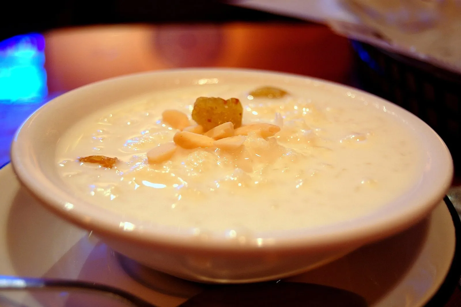 Kheer rice pudding garnished with almonds, pistachios and saffron