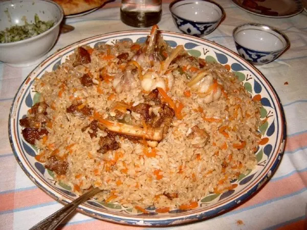 Lamb kabsa with tender bone-in lamb over spiced basmati rice