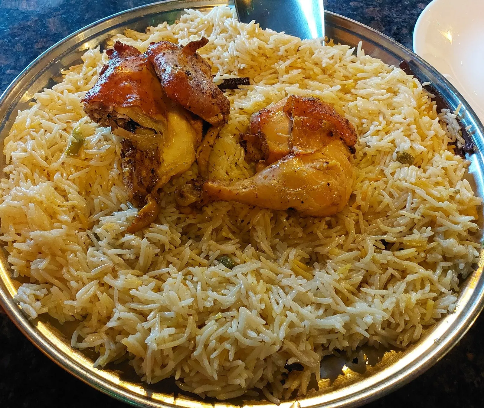 Madghout pressure-cooked meat and rice garnished with nuts
