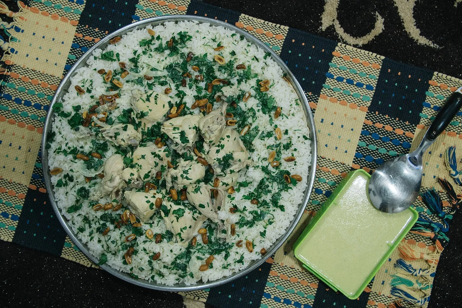 Mathloutha platter combining kabsa, mandi and madghout rices with mixed meats